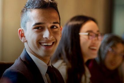 Male student smiling in the classroom