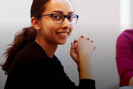 Female student smiling in the classroom