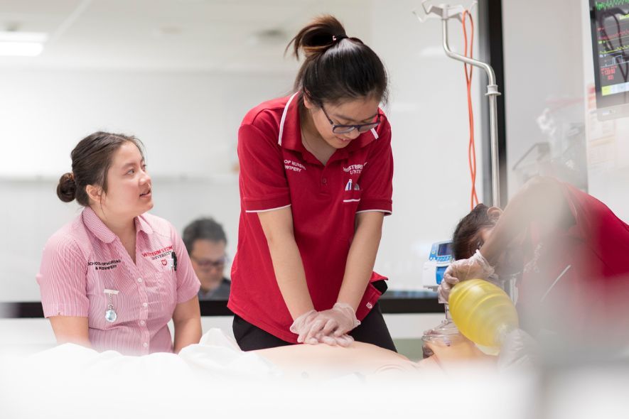 Health Science students taking care of patient