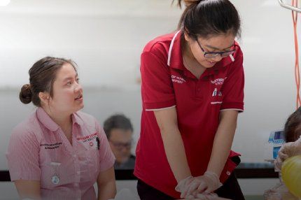 Health Science students taking care of patient