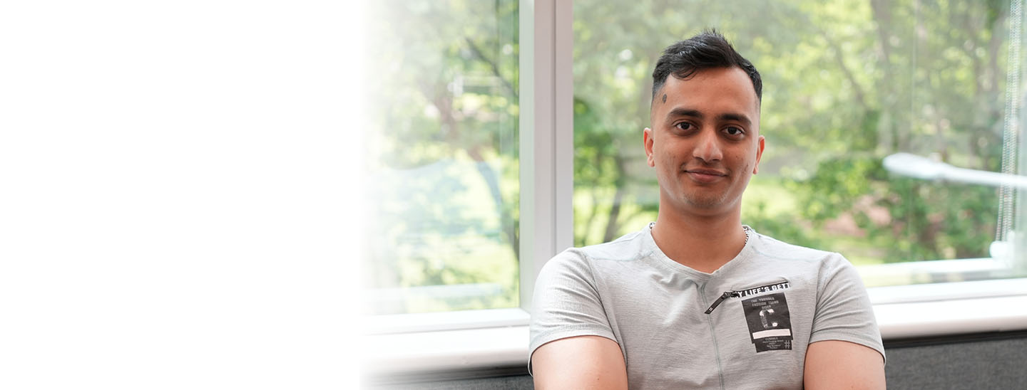 Student sitting near window