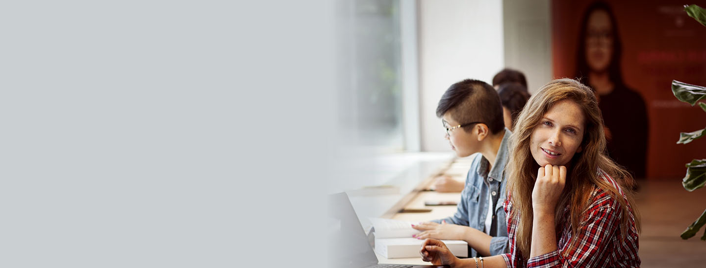 Student studying near window