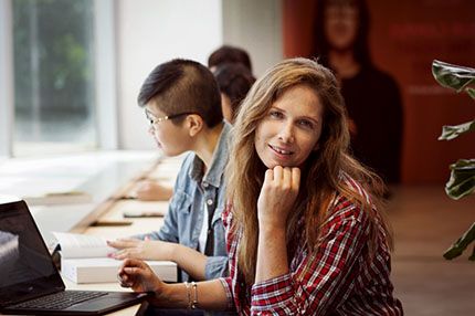Student studying near window