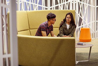 Students sitting inside couch