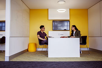 Students sitting inside meeting together