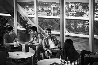 Students sitting near window black white