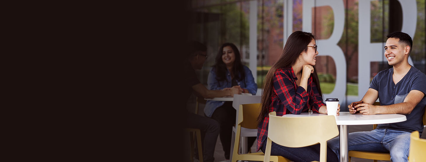 Students sitting outside socialising