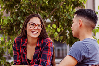 Students sitting outside talking