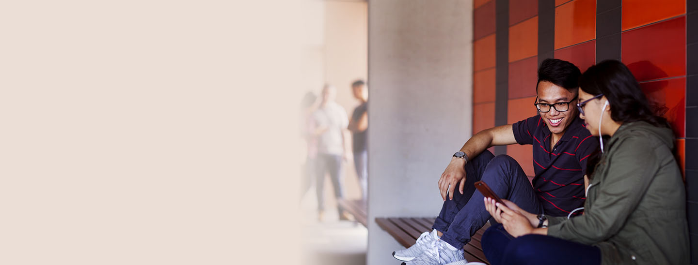 Students sitting wall studying